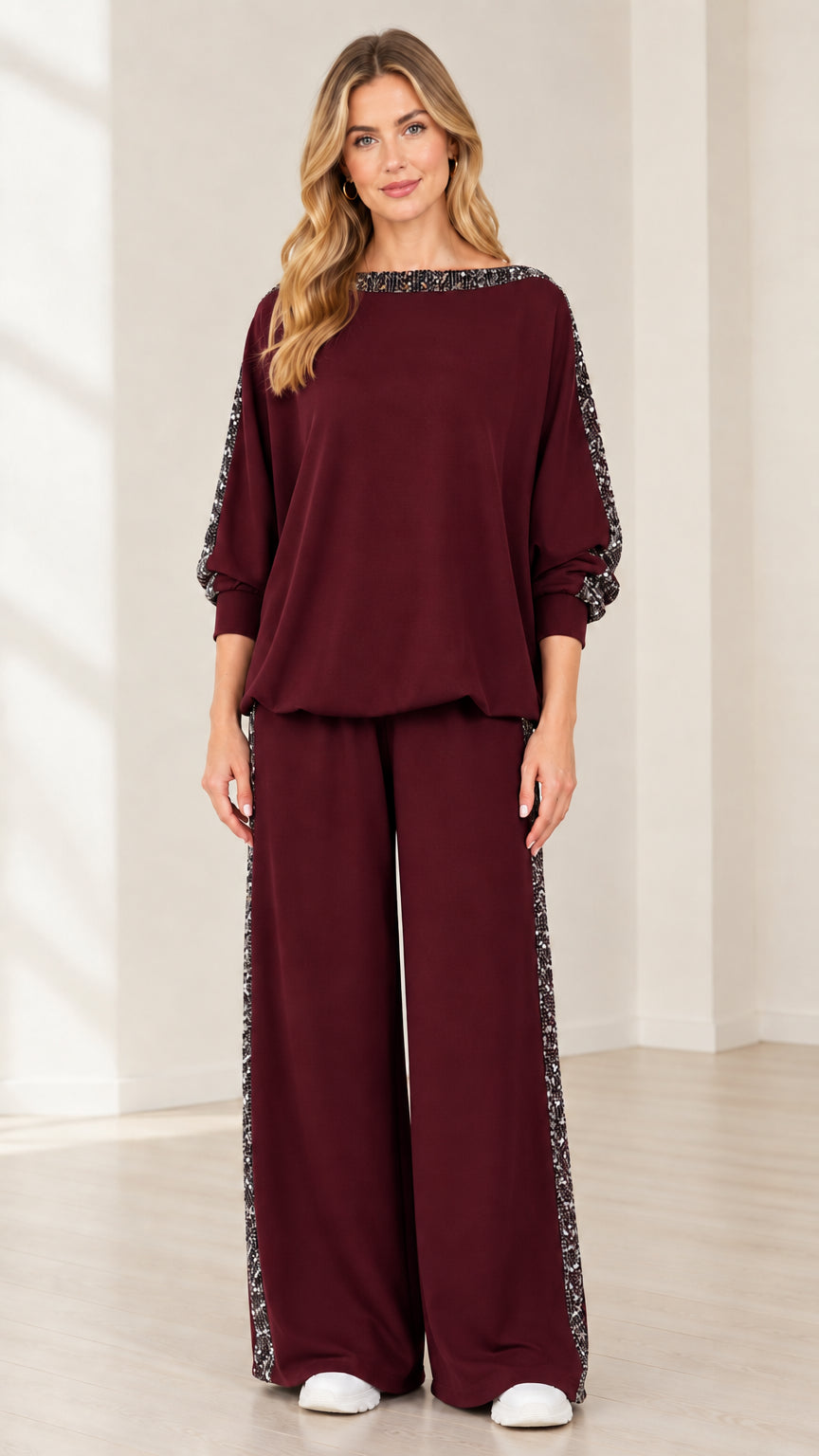 Woman wearing burgundy wine red 2-piece sequin detail matching set