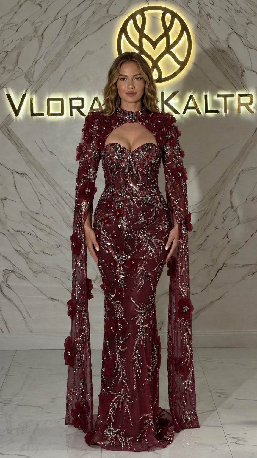 Burgundy wine beaded mermaid evening gown with keyhole cutout and floral cape