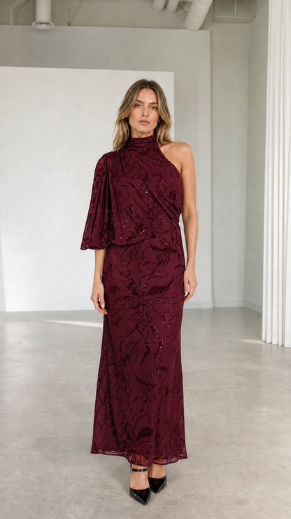 Model wearing burgundy wine one-shoulder high neck embellished formal gown