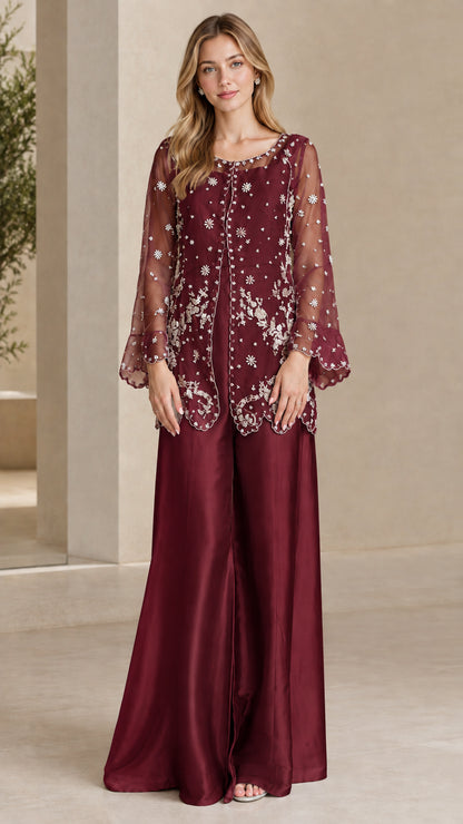 Model wearing Burgundy red embroidered formal tunic and evening pant set