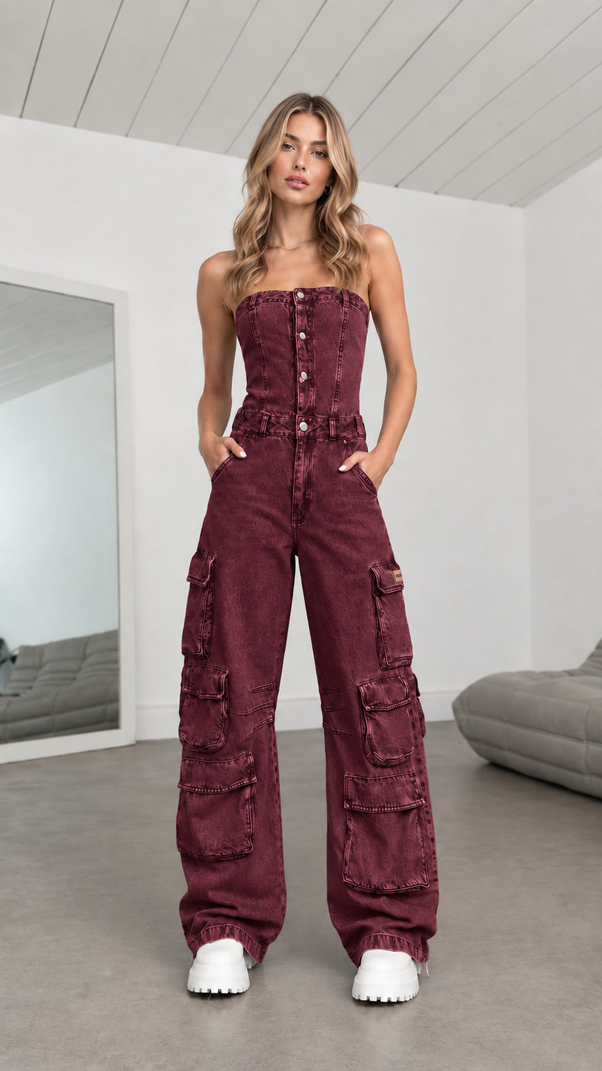 Model wearing Burgundy red strapless denim cargo wide leg jumpsuit