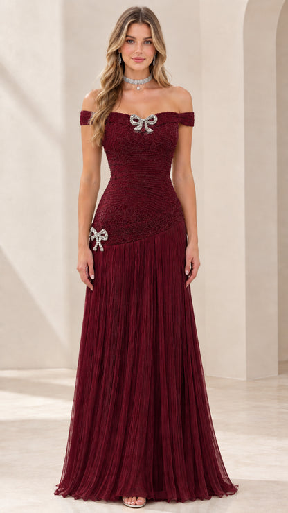 Full-length view of rich burgundy off-the-shoulder gala dress