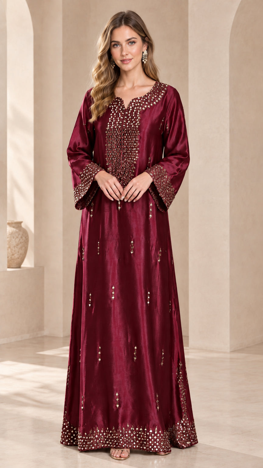 Model wearing a rich burgundy wine embellished satin kaftan dress