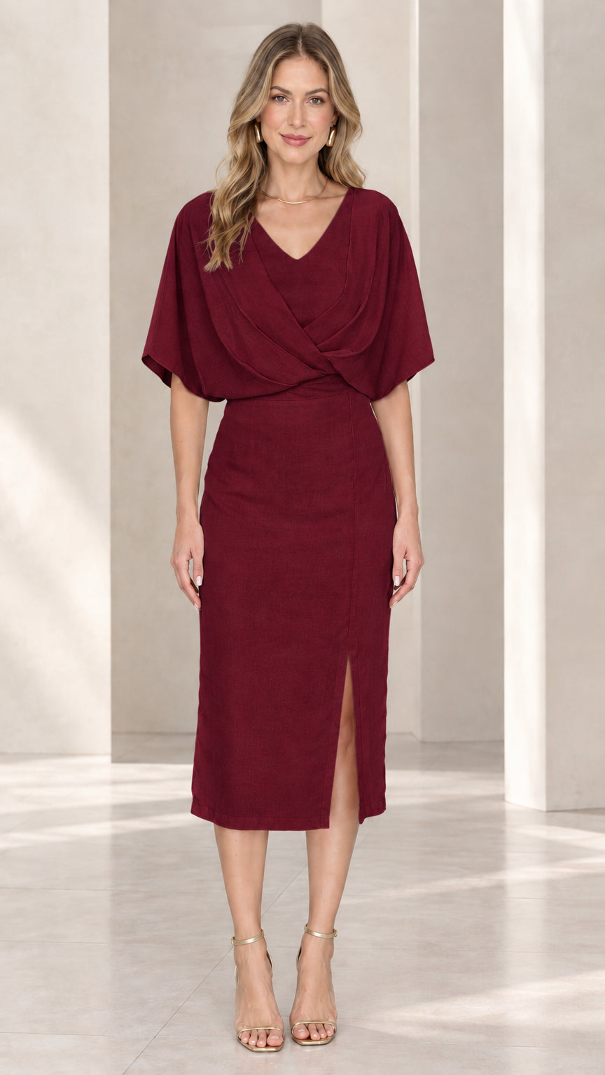 Front view of model wearing burgundy flutter sleeve midi cocktail dress