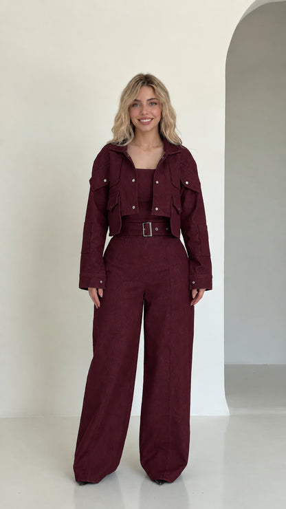 Full front view of burgundy cropped utility jacket and wide-leg pant set