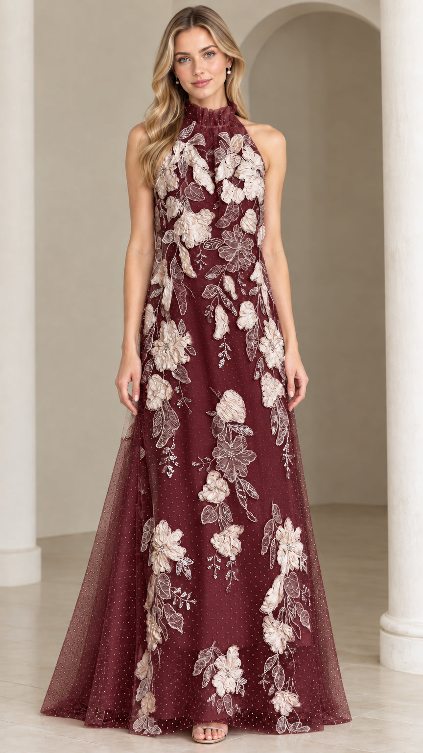 Front view of burgundy red tulle evening gown with cream floral appliques