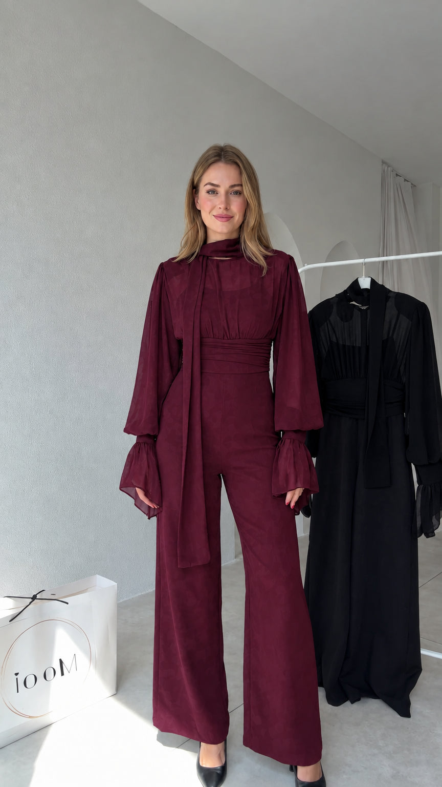 Full front view of model wearing Burgundy tie-neck wide-leg jumpsuit