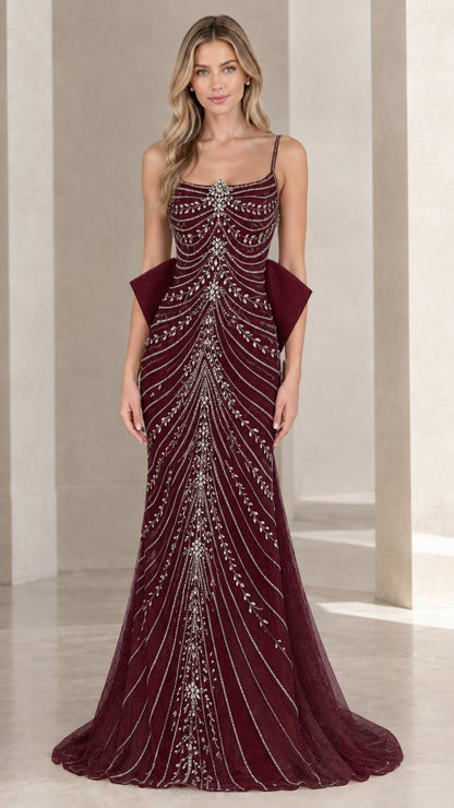 Front view of burgundy beaded spaghetti strap formal gown with back bow accent