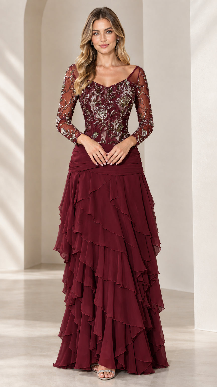 Front view of Burgundy long sleeve evening gown with embroidered illusion top