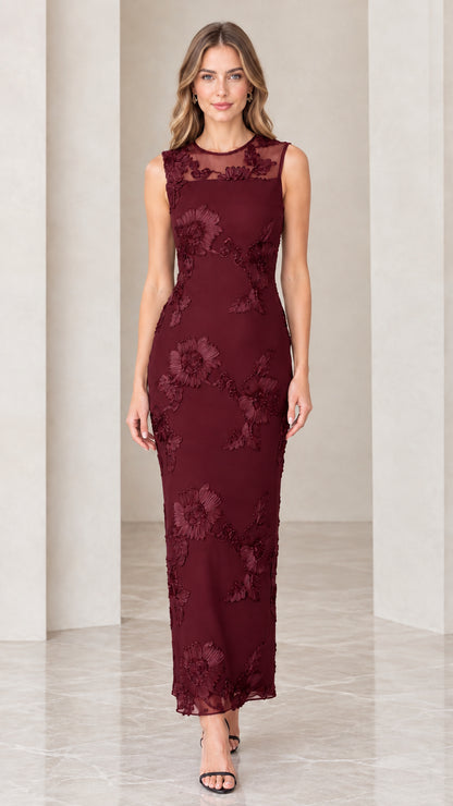 Model wearing burgundy red floral appliqué sleeveless column maxi dress