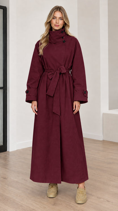 Full length view of women's burgundy high neck maxi trench coat