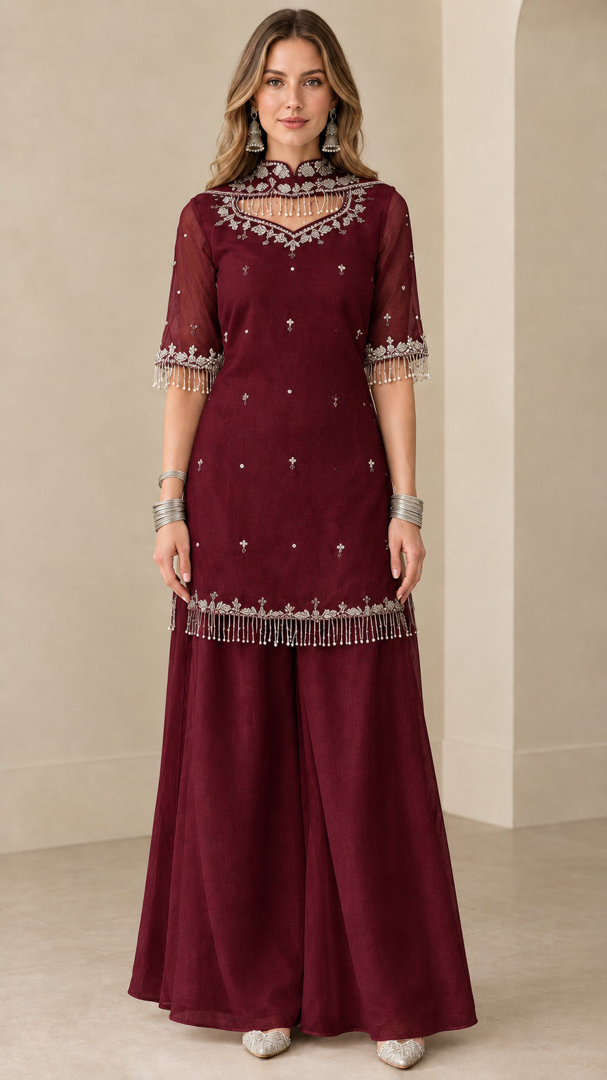 Front view of burgundy wine embroidered kurti sharara suit set