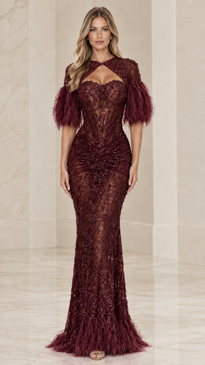 Front view of burgundy wine beaded lace mermaid evening dress with matching feather accents