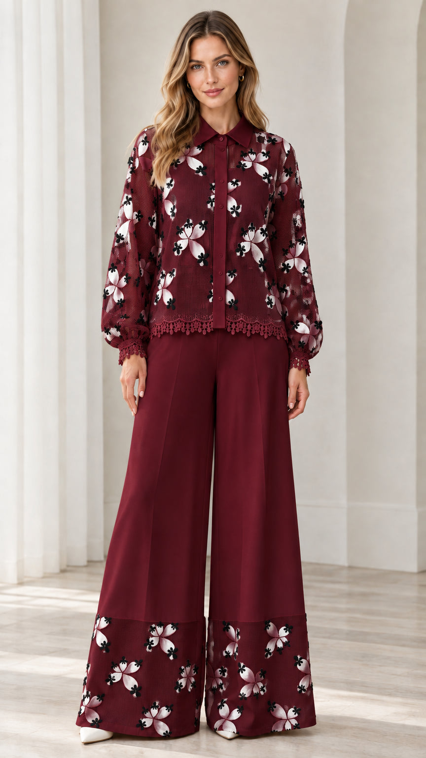 Model wearing burgundy red floral embroidered lace blouse and wide leg pant set