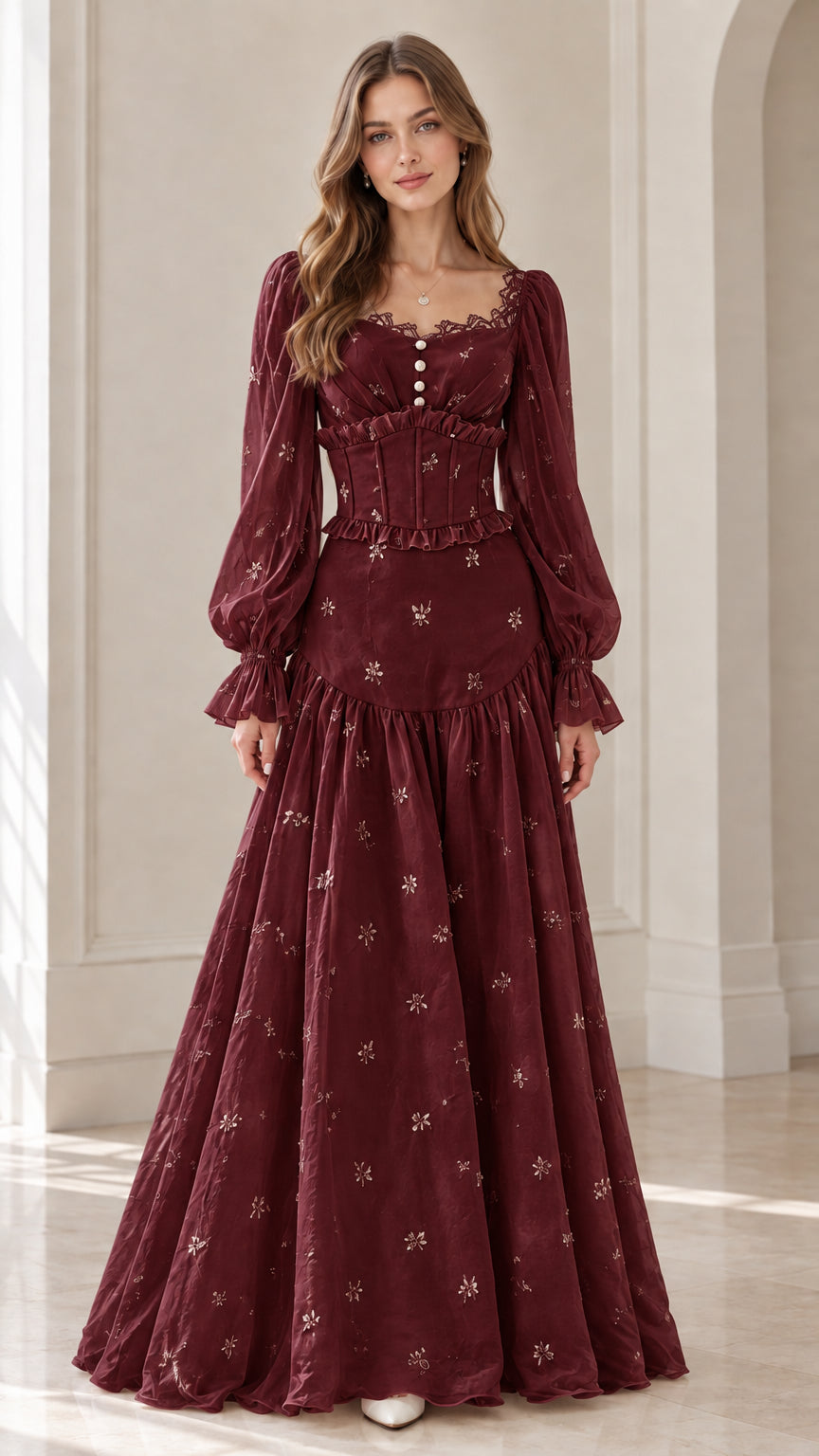Front view of model wearing burgundy wine corset long sleeve maxi dress
