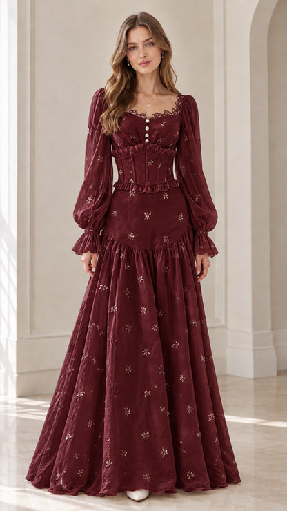 Front view of model wearing burgundy wine corset long sleeve maxi dress