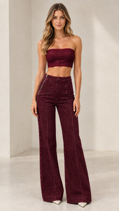 Model wearing Burgundy high-rise seamed flare jeans paired with burgundy top