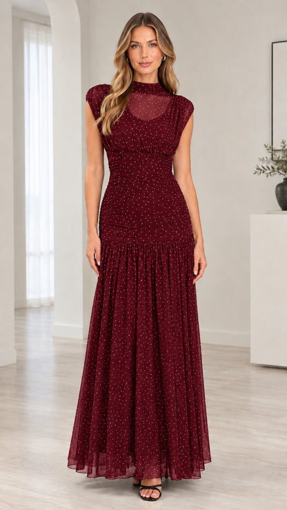 Front full-length view of model wearing burgundy wine sparkle mesh ruched evening maxi dress