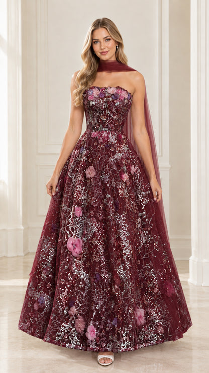 Front view of model wearing burgundy wine strapless floral sequin formal ball gown with scarf