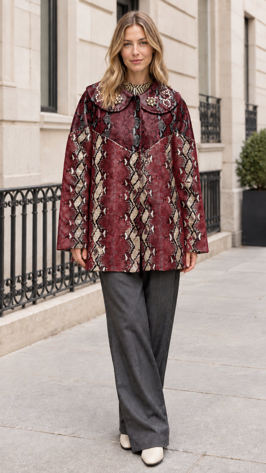 Model wearing Burgundy snakeskin print coat