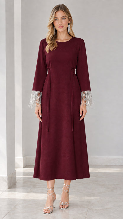 Front view of burgundy wine long sleeve formal maxi dress with fringe cuffs