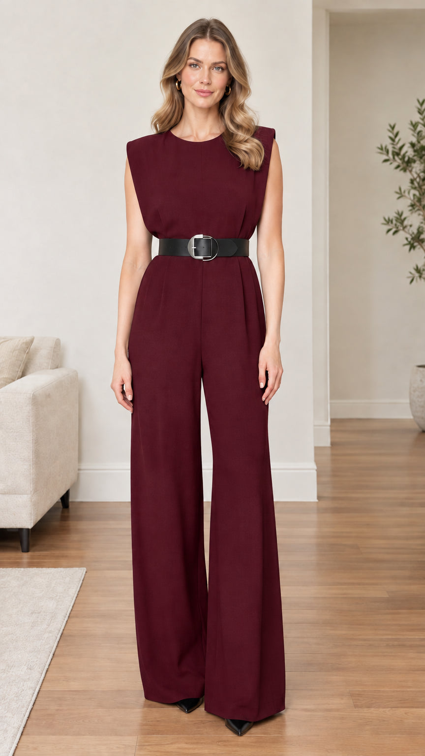 Model wearing burgundy wine sleeveless wide-leg jumpsuit with black belt