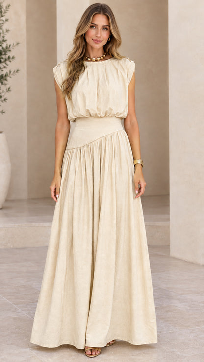 Model wearing beige cream sleeveless pleated waist maxi dress