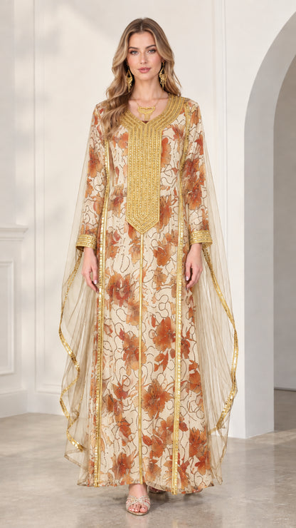 Model wearing cream floral kaftan dress with gold embroidery and lightweight cape sleeves