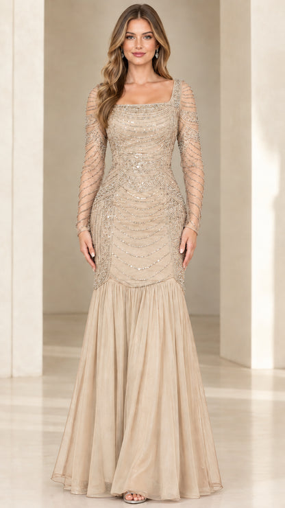 Front view of champagne gold beaded trumpet evening gown with sheer sleeves
