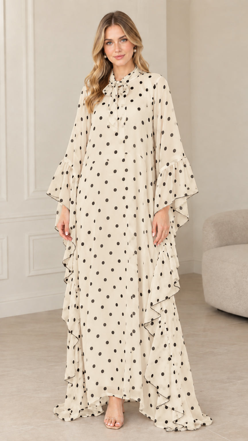 Full front view of beige cream polka dot tie neck kaftan maxi dress