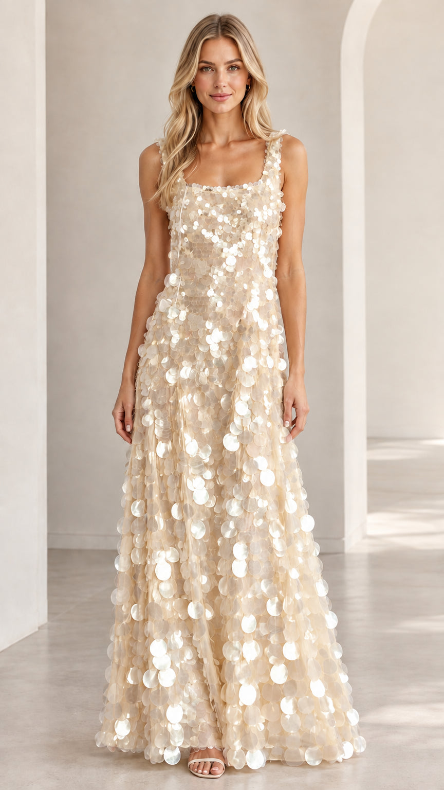 Front view of champagne gold sleeveless sequin maxi gown