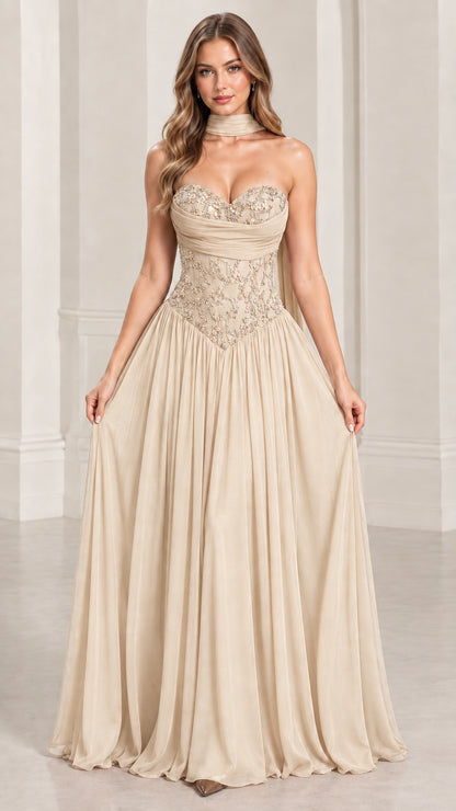 Front view of champagne strapless formal gown with sequin embellished corset