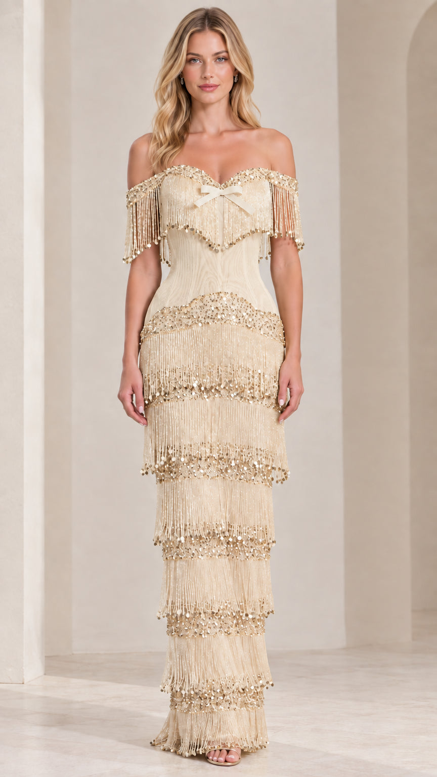 Front view of champagne off-shoulder tiered fringe maxi evening dress