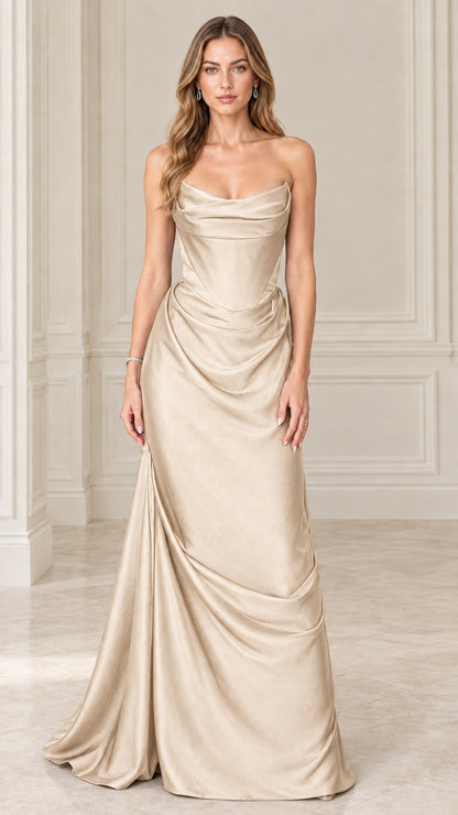 Model wearing champagne gold strapless satin corset draped maxi dress