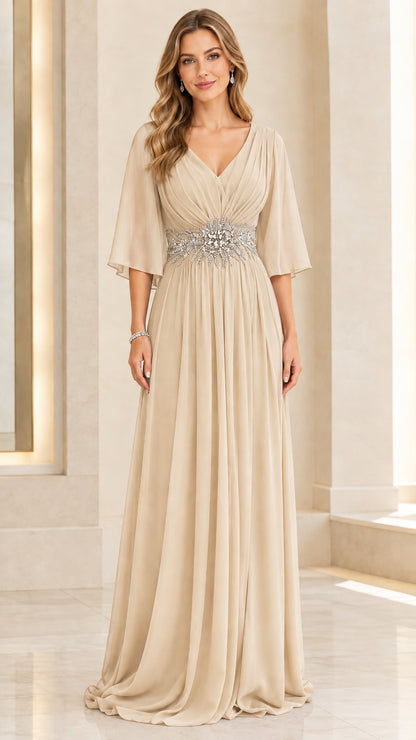 Woman wearing champagne beige pleated V-neck chiffon evening maxi dress