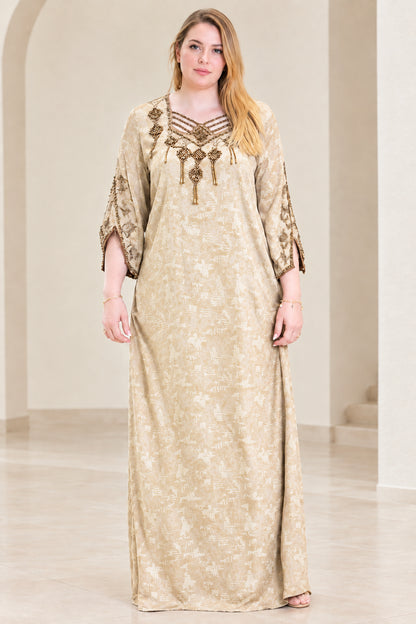 Front view of woman wearing champagne beige beaded strappy neckline kaftan dress