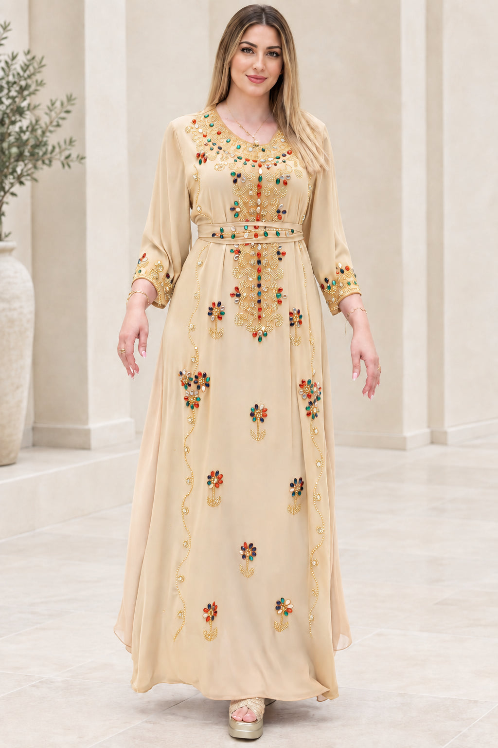 Front view of champagne beige embellished kaftan maxi dress with tie belt