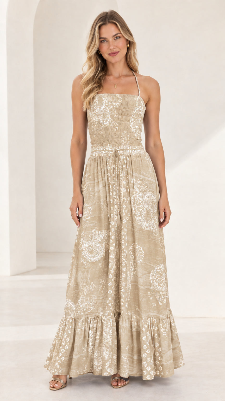 Full-length front view of beige champagne printed smocked tiered maxi dress