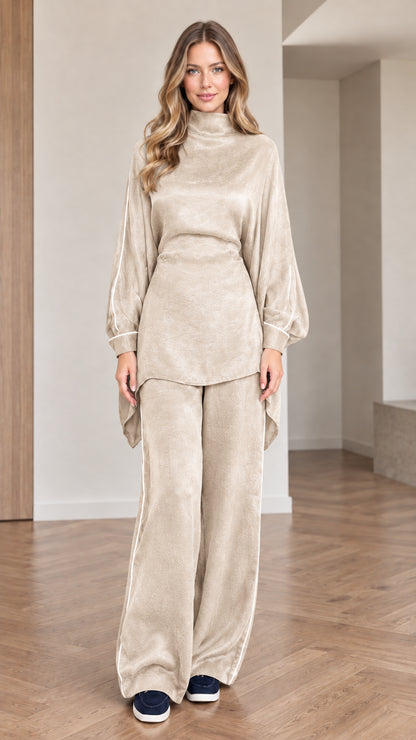 Front view of women wearing beige cream mock neck tunic top and wide leg pants set