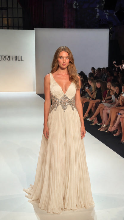 Ivory pleated floor-length evening gown with a deep V-neck and embellished waist