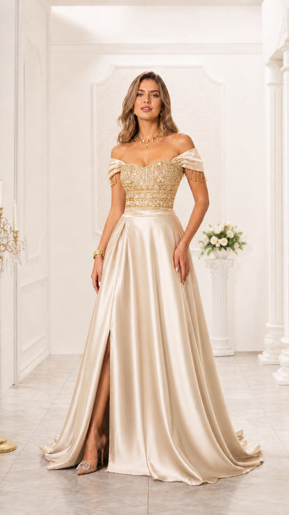 Model wearing champagne gold off-the-shoulder embroidered satin evening gown with slit