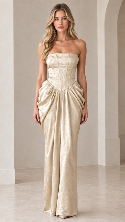 Front view of model wearing Champagne gold strapless corset draped maxi dress
