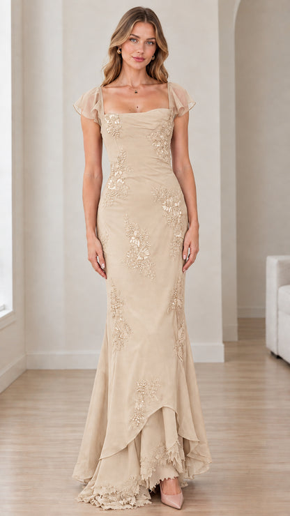 Front view of champagne nude beaded embroidered mermaid evening gown