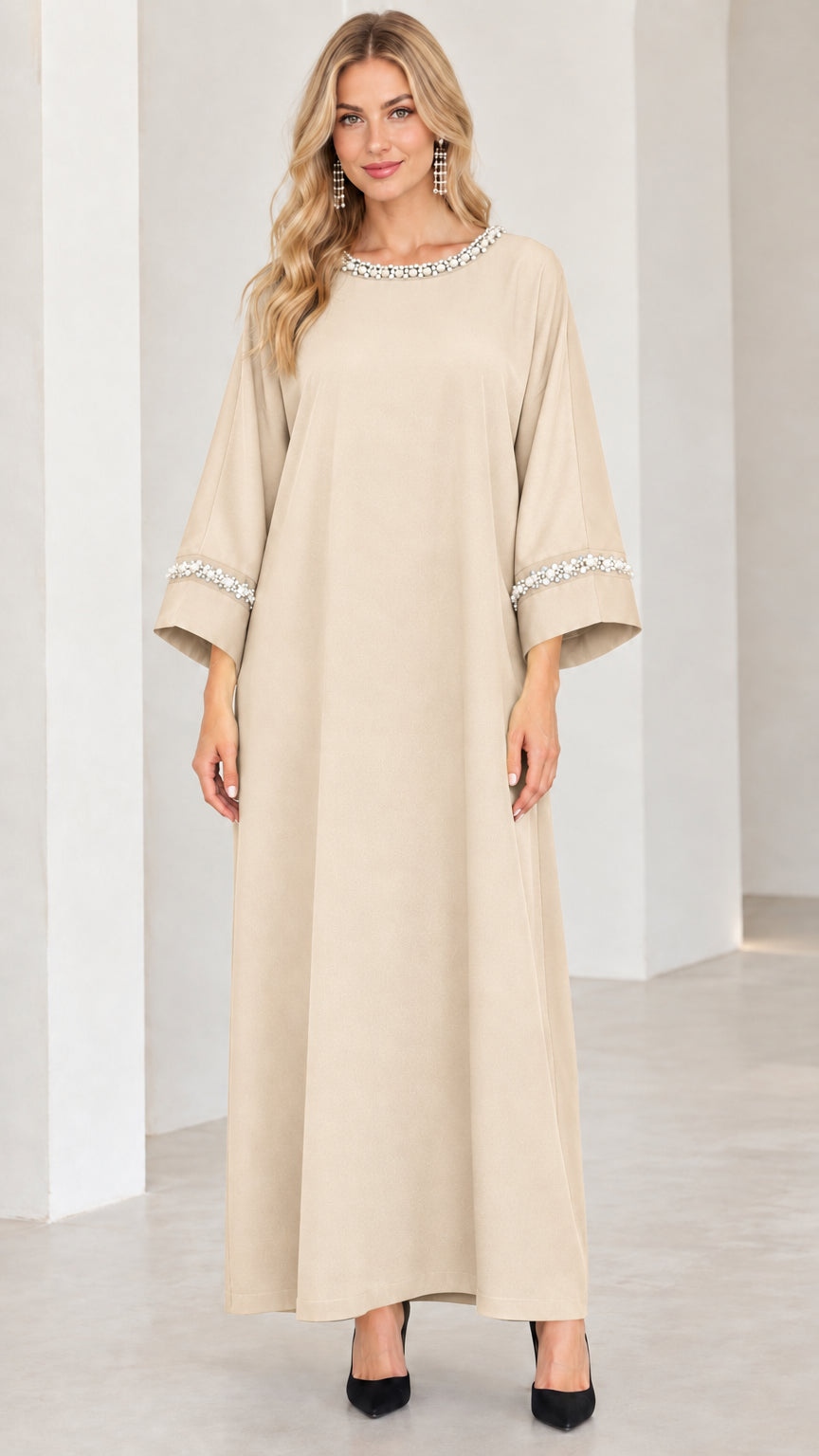 Front view of woman wearing beige champagne pearl trim modest maxi dress