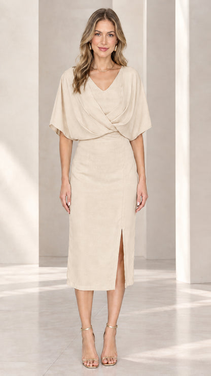 Front view of model wearing beige draped v-neck midi sheath dress