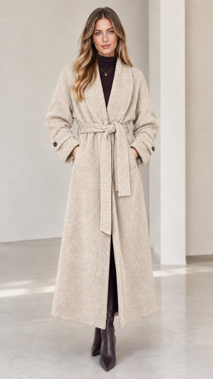 Front view of woman wearing oatmeal beige herringbone maxi wrap coat