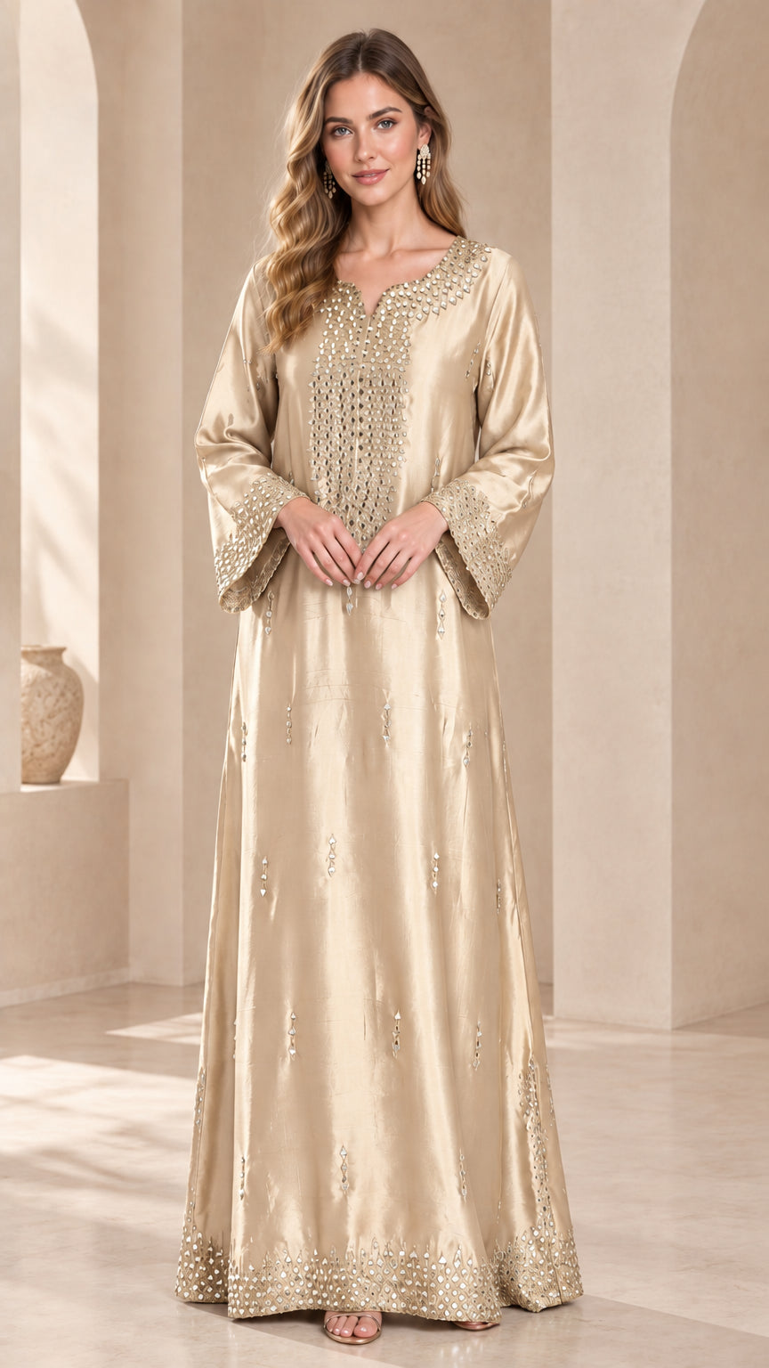 Model wearing a champagne gold beaded satin maxi kaftan dress